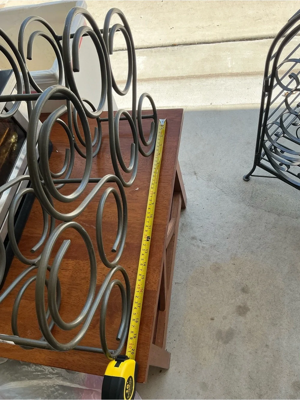 This is Vintage iron wine rack features a heavy scroll design and holds 8 bottle